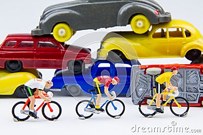 Miniature tiny toys cyclist ride bicycle in The abandoned car ce Stock Photo