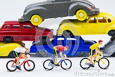 Miniature tiny toys cyclist ride bicycle in The abandoned car ce Stock Photo