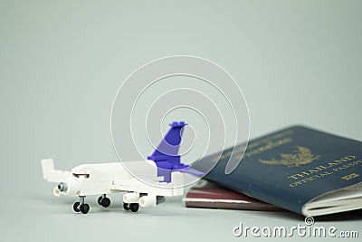 Toy airplane and Thai citizen passport and Thailand official passport Stock Photo