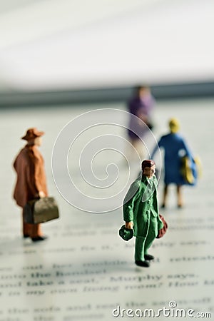 Miniature traveler people on an e-book reader Stock Photo