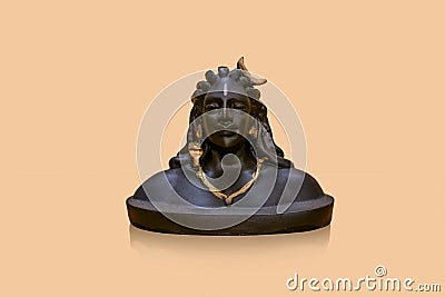 Miniature version of Adiyogi Shiva idol sitting on reflected background Stock Photo