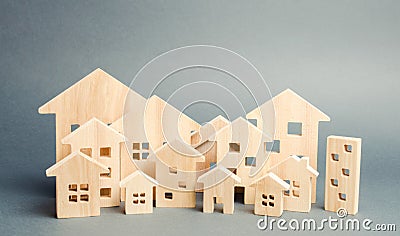 Miniature wooden houses. Real estate. City. Agglomeration and urbanization. Real Estate Market Analytics. Demand for housing. Stock Photo