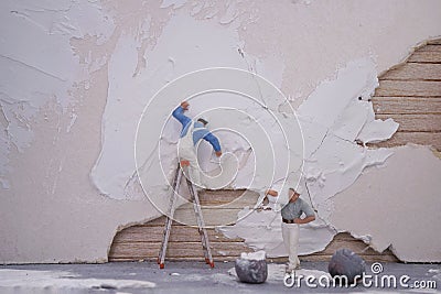 Miniature worker team repair house Stock Photo