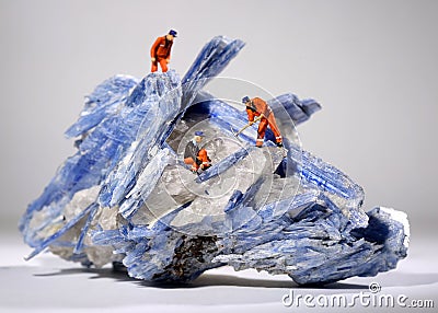 Miniature Workers in the Mining of Minerals Field Stock Photo