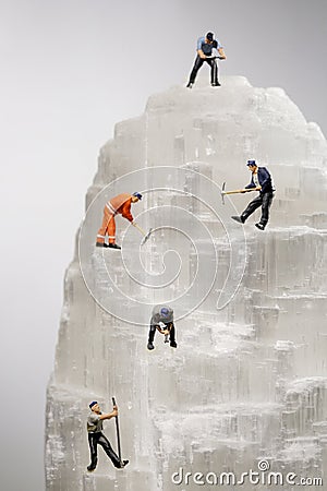 Miniature Workers in the Mining of Minerals Field Stock Photo