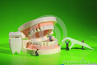 Miniature Workers Performing Dental Procedures. Dental Office Ar Stock Photo