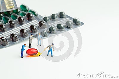 Miniature working with pills medical business concept. Stock Photo