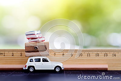 Miniatures car with ruler, book and pencil. Stock Photo