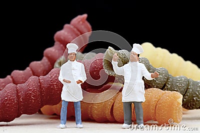 Miniatures of chef with pasta Stock Photo