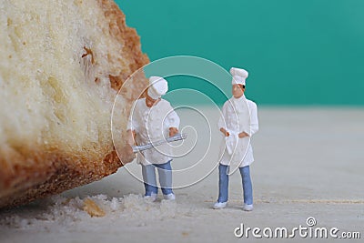 Miniatures of cooks with bread Stock Photo