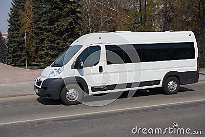 Minibus goes on city Stock Photo