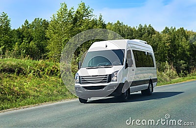 Minibus goes on the country highway Stock Photo