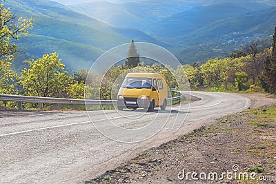 minibus is moving along the road in the highlands Stock Photo