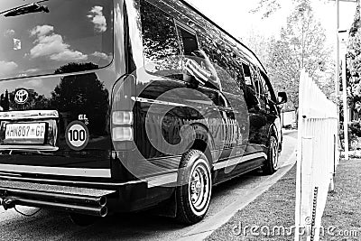 Minibus taxi van parked outside a house in a wealthy neighborhoo Editorial Stock Photo