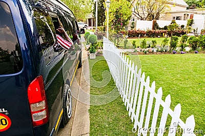 Minibus taxi van parked outside a house in a wealthy neighborhood Editorial Stock Photo