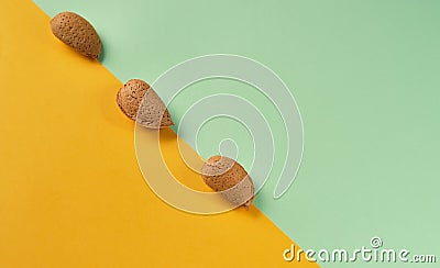 Minimal composition with unshelled Almonds on colorful background Stock Photo