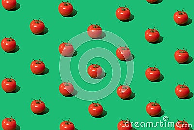 Minimal concept made of tomato pattern on green background. Red tomatoes pop art composition. Trendy vegetable. Flat lay Stock Photo