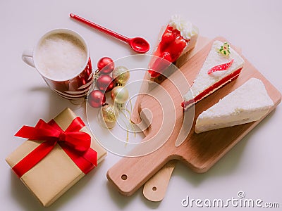 minimal flat lay concept for christmas and new year event by coffee cup ,strawberry and coconut cake on wooden chopping board arr Stock Photo
