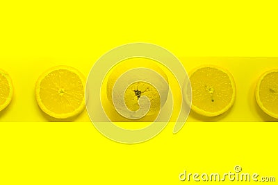 Minimal food concept. Lemon on a bright yellow background. Free space for text. Top view. Minimalism. Creative citrus fruits Stock Photo