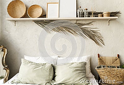Minimal home interior bedroom design in boho style. Pillows, blanket and decorations Stock Photo
