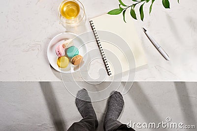 Minimal styled flat lay table with open notebook, croissant and Stock Photo