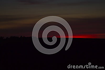 Minimalism photo with tree in middle during red sunset with amazing sky, suitable for background Stock Photo