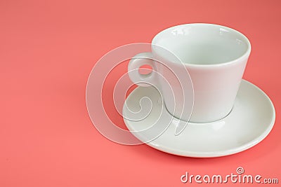 Minimalism white empty Cup with saucer on pink background Stock Photo