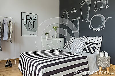 Minimalist bedroom with blackboard wall Stock Photo