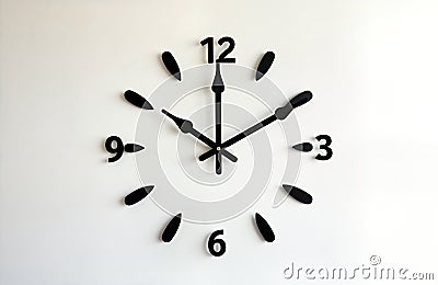 Minimalist black wall clock with round dial, black numbers. Modern style, simple design. Abstract shapes, arrows. Simple design. Stock Photo