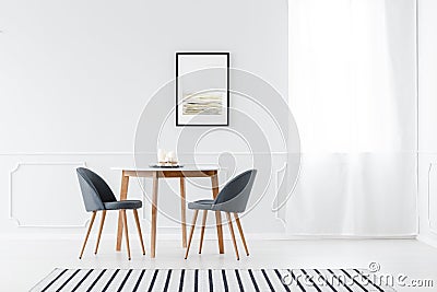 Minimalist dining room with poster Stock Photo