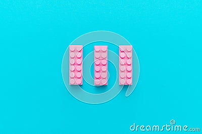 Minimalist flat lay photo of three pink plastic blocks Stock Photo