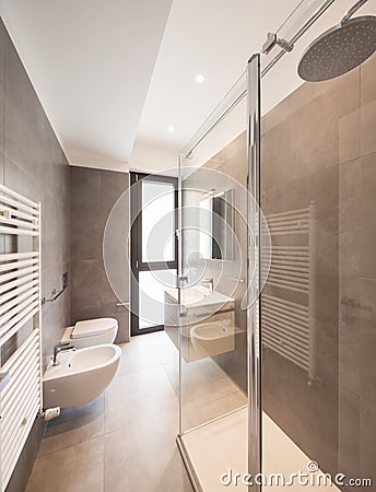 Minimalist modern bathroom with large tiles Stock Photo