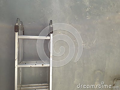 Minimalist photography : folding ladder a wall Stock Photo