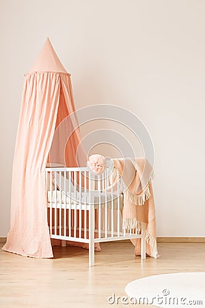 White crib by empty wall Stock Photo