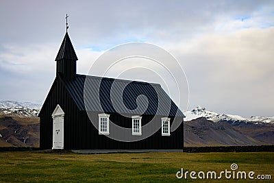 Minimalistic black Budir church in the countryside of Iceland Stock Photo