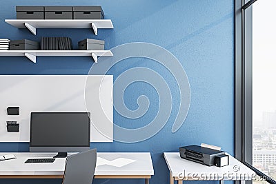 Minimalistic blue workplace with Ñomputer on table Stock Photo