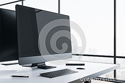 Minimalistic designer desktop with empty black computer screen Editorial Stock Photo