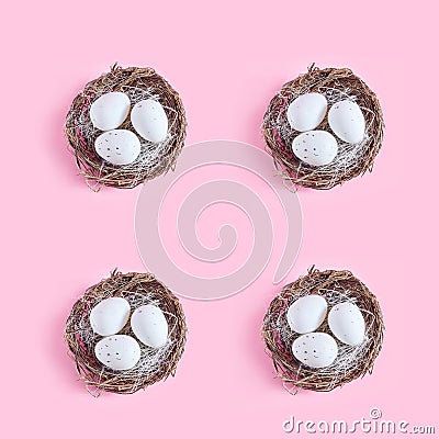 minimalistic Easter composition. pattern of four decorative nests on a pink background. Stock Photo