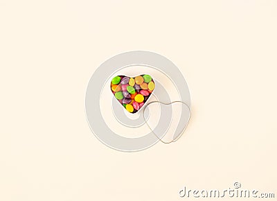 Minimalistic isolated shaped heart bowl with colorful candies on bright background. Stock Photo