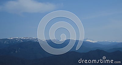 Minimalistic landscape , no people. View of snowy peak of Mount Fisht from afar. Main Caucasian ridge in reserve Stock Photo