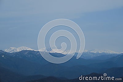 Minimalistic landscape , no people. View of snowy peak of Mount Fisht from afar. Main Caucasian ridge in reserve Stock Photo