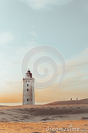 Minimalistic photo of people at sunset Rubjerg Knude Lighthouse Denmark Stock Photo