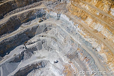 Mining from above. Industrial terraces on open pit mineral mine. Aerial view of opencast mining. Dolomite Mine Excavation. Editorial Stock Photo