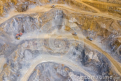 Mining from above. Industrial terraces on open pit mineral mine. Aerial view of opencast mining. Dolomite Mine Excavation. Editorial Stock Photo