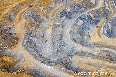 Mining from above. Industrial terraces on open pit mineral mine. Aerial view of opencast mining. Dolomite Mine Excavation. Stock Photo