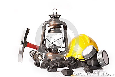 Mining tools with protective helmet, ear muffs and oil lantern Stock Photo