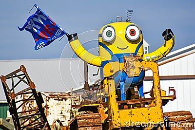 Minion on a Tractor Holding a Trump Flag Editorial Stock Photo