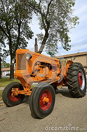Minneapolis Moline tractor parked on Main Street Editorial Stock Photo
