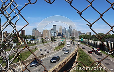 Minneapolis Skyline through a Chain link Fence Editorial Stock Photo