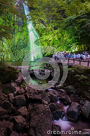 Minoh waterfall full of tourists take photo in summer and waiting for light up Editorial Stock Photo